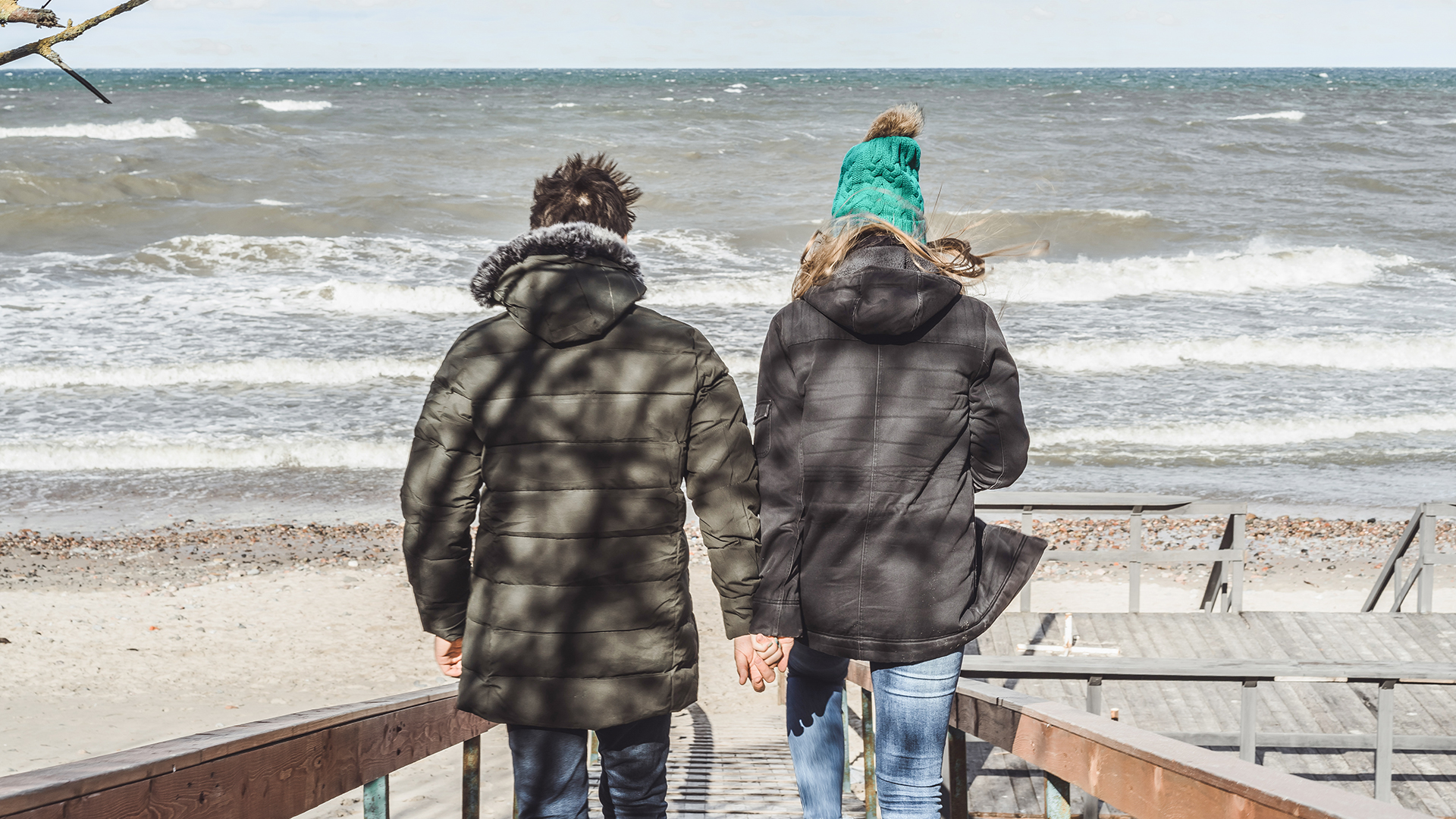 young couple of the cold Baltic sea